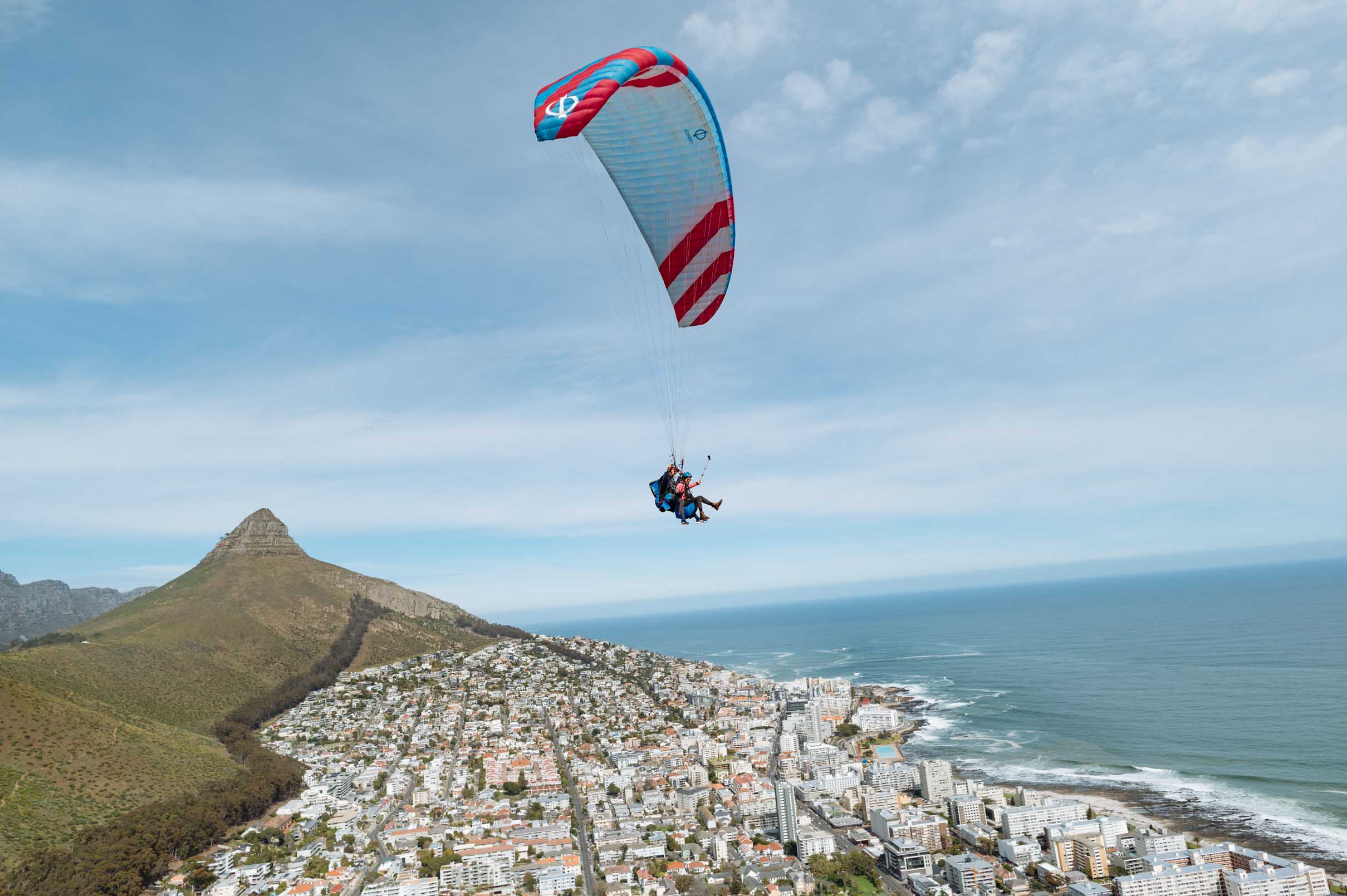 Paraglider soaring above the Atlantic Ocean